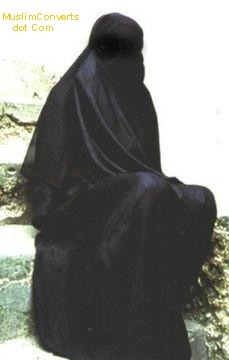 muslim woman wearing a black full niqab and an abayah. The correct muslim dress 